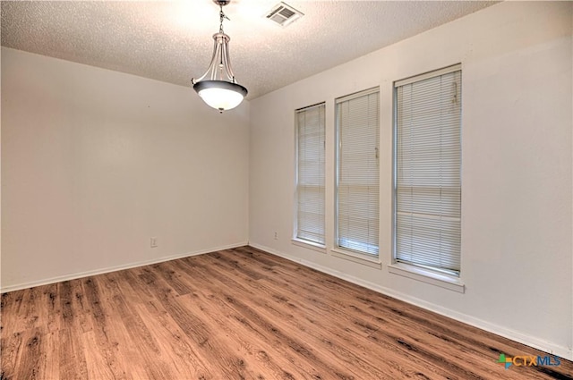 2006 Canyon Creek Dr, Temple, TX 76502 - unfurnished room featuring wood finished floors and a textured ceiling