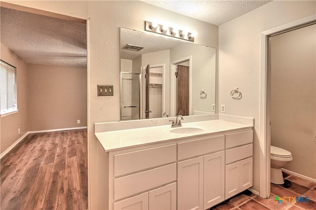 2006 Canyon Creek Dr, Temple, TX 76502 - full bath with a textured ceiling, vanity, and wood finished floors