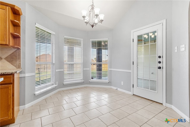 unfurnished dining area featuring lofted ceiling, light tile patterned floors, and an inviting chandelier