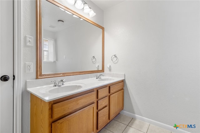 bathroom with tile patterned flooring and vanity