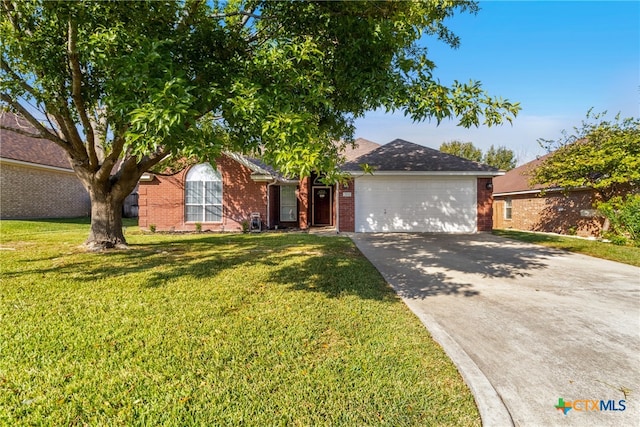 single story home with a front yard and a garage