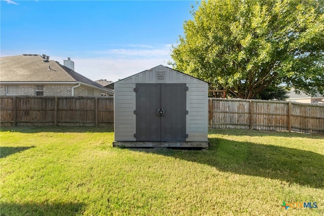 view of outbuilding with a lawn