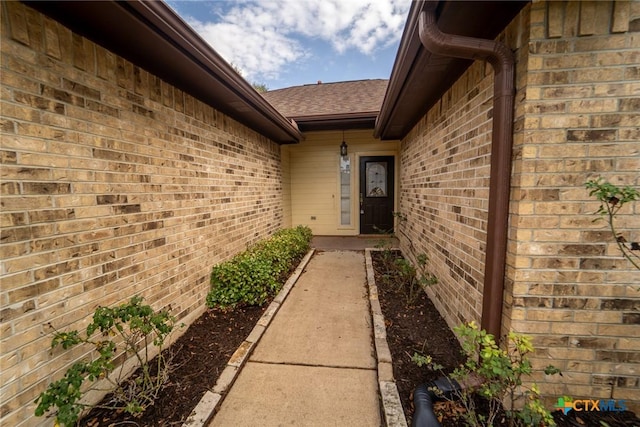 206 Ashland Crk, Victoria, TX 77901 - entrance to property featuring brick siding and a shingled roof