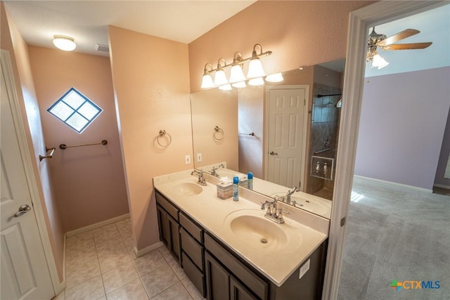 bathroom with tile patterned flooring, ceiling fan, and vanity