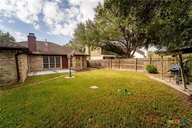206 Ashland Crk, Victoria, TX 77901 - fenced backyard with a patio area