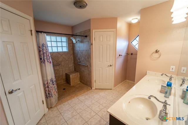 206 Ashland Crk, Victoria, TX 77901 - bathroom with tile patterned floors, tiled shower, and double vanity
