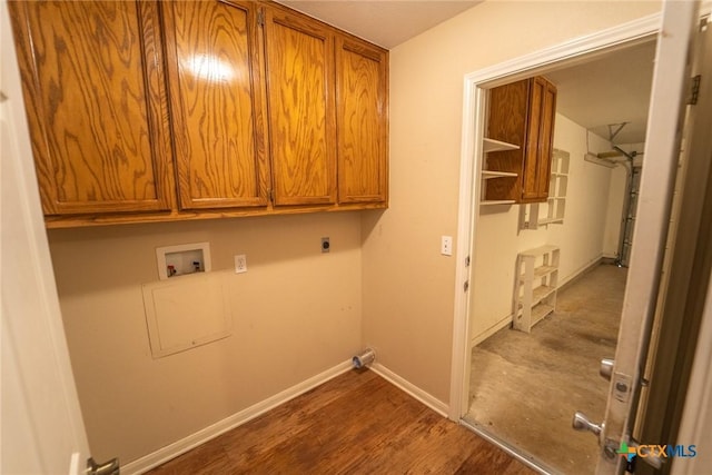206 Ashland Crk, Victoria, TX 77901 - washroom with washer hookup, cabinet space, hookup for an electric dryer, and dark wood-style floors
