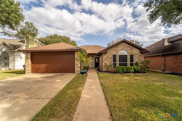 ranch-style home featuring a front yard and a garage