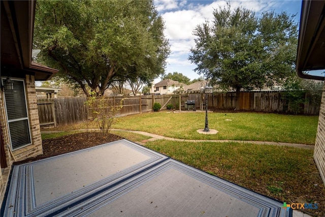 206 Ashland Crk, Victoria, TX 77901 - fenced backyard featuring a patio