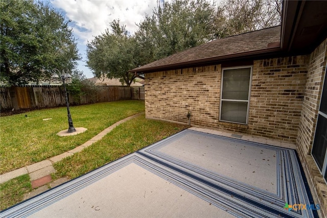 206 Ashland Crk, Victoria, TX 77901 - fenced backyard featuring a patio