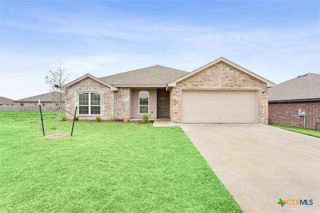 1306 Campbelton Dr, Temple, TX 76504 - ranch-style home with a garage, concrete driveway, brick siding, and a front yard