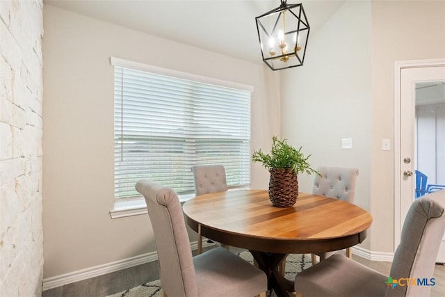 1306 Campbelton Dr, Temple, TX 76504 - dining space with baseboards, a notable chandelier, and wood finished floors