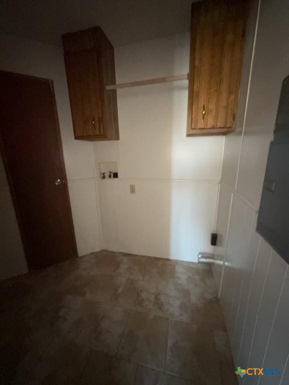 clothes washing area featuring cabinet space and washer hookup