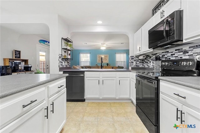 kitchen with tasteful backsplash, white cabinets, a sink, ceiling fan, and black appliances