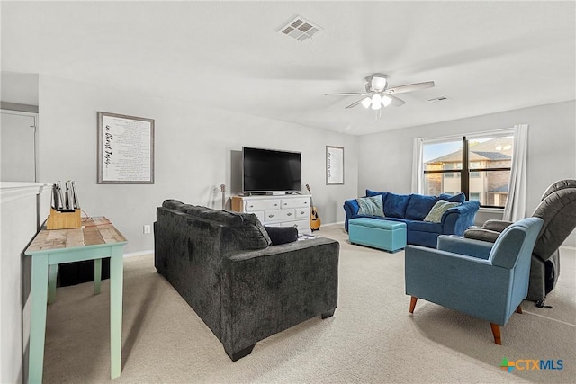 living room with baseboards, visible vents, a ceiling fan, and carpet flooring