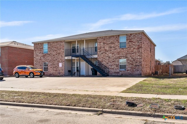 exterior space with stairs and fence