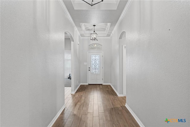 730 Eagle Pass Dr, Salado, TX 76571 - doorway to outside with hardwood / wood-style flooring, ornamental molding, and a raised ceiling