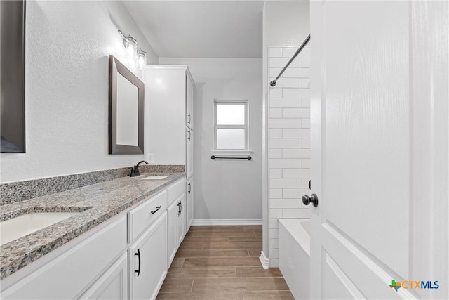 730 Eagle Pass Dr, Salado, TX 76571 - bathroom featuring tiled shower / bath combo and vanity