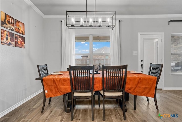 730 Eagle Pass Dr, Salado, TX 76571 - dining space featuring hardwood / wood-style floors and crown molding
