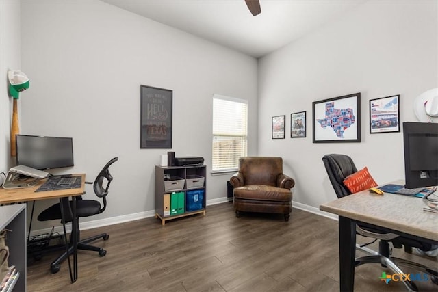 home office with dark hardwood / wood-style floors and ceiling fan