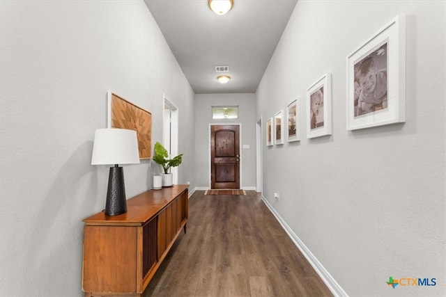 doorway with dark hardwood / wood-style flooring