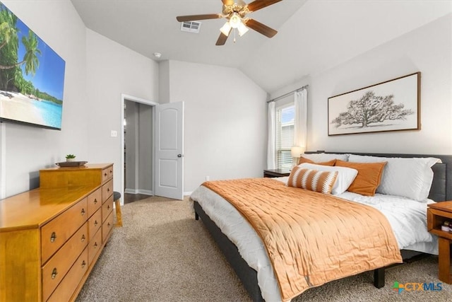 carpeted bedroom featuring ceiling fan and lofted ceiling