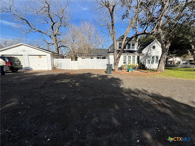 view of yard featuring a garage and an outdoor structure