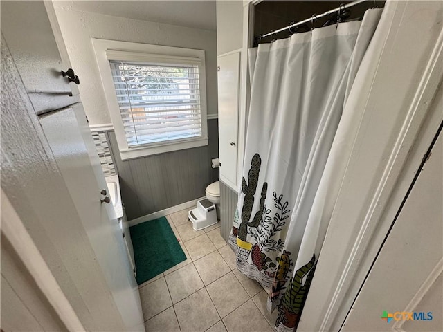 bathroom featuring tile patterned flooring and toilet