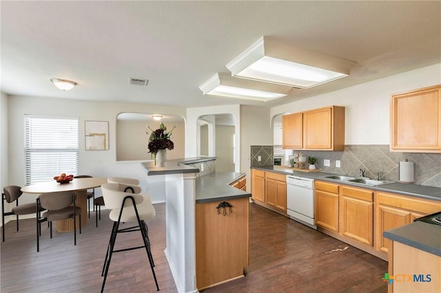 425 Starview St, Temple, TX 76502 - kitchen with a sink, arched walkways, dishwasher, and dark wood-type flooring
