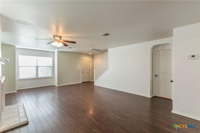 spare room featuring dark hardwood / wood-style floors and ceiling fan