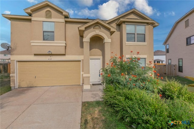 425 Starview St, Temple, TX 76502 - view of front of home with an attached garage, fence, driveway, and stucco siding