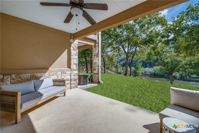 view of patio with outdoor lounge area and ceiling fan