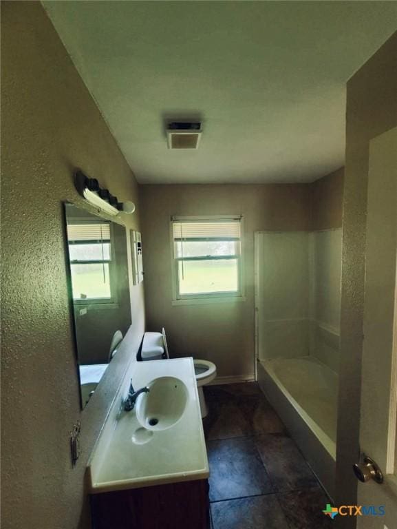 full bath with visible vents, a shower, toilet, and vanity