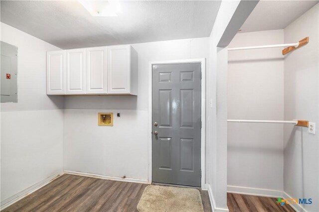 2460 N State Highway 95, Moulton, TX 77975 - washroom with washer hookup, cabinet space, electric panel, and dark wood finished floors