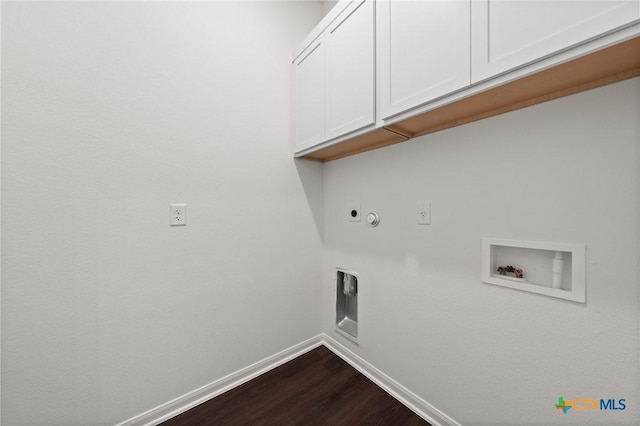 laundry area with gas dryer hookup, hookup for a washing machine, baseboards, cabinet space, and electric dryer hookup