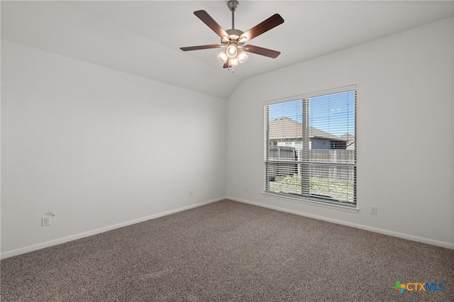 spare room with carpet, ceiling fan, lofted ceiling, and baseboards