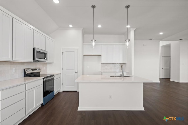 kitchen featuring dark wood finished floors, appliances with stainless steel finishes, light countertops, white cabinetry, and a sink