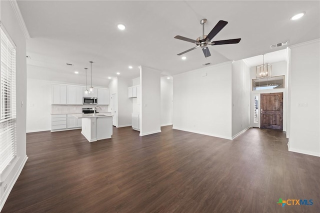 unfurnished living room with visible vents, a ceiling fan, dark wood-type flooring, a sink, and recessed lighting