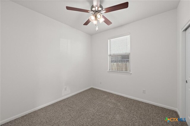 spare room with ceiling fan, baseboards, and carpet flooring