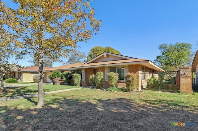 ranch-style house with a front yard