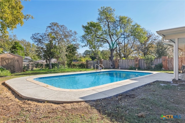 view of swimming pool with a storage shed