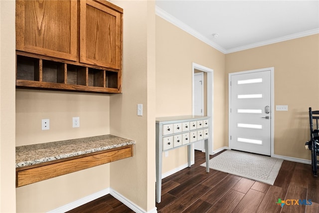 entryway with dark wood-type flooring and ornamental molding