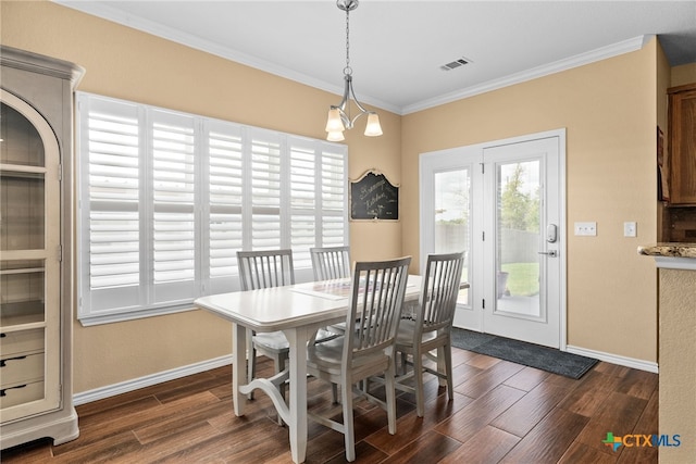 dining room featuring crown molding, an inviting chandelier, and dark hardwood / wood-style flooring