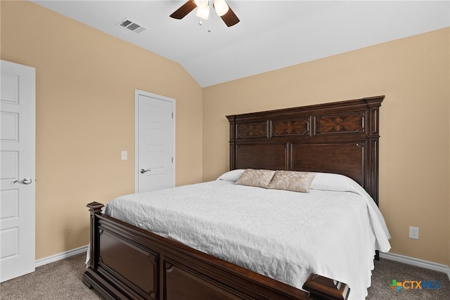 carpeted bedroom featuring ceiling fan and vaulted ceiling