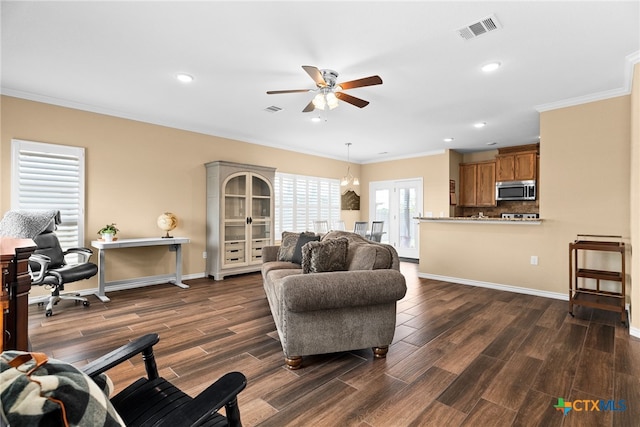 living room featuring dark wood-type flooring, ceiling fan, and ornamental molding