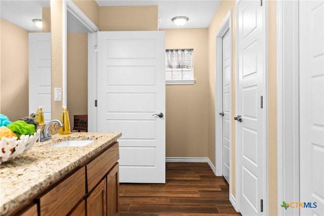 bathroom with wood-type flooring and vanity