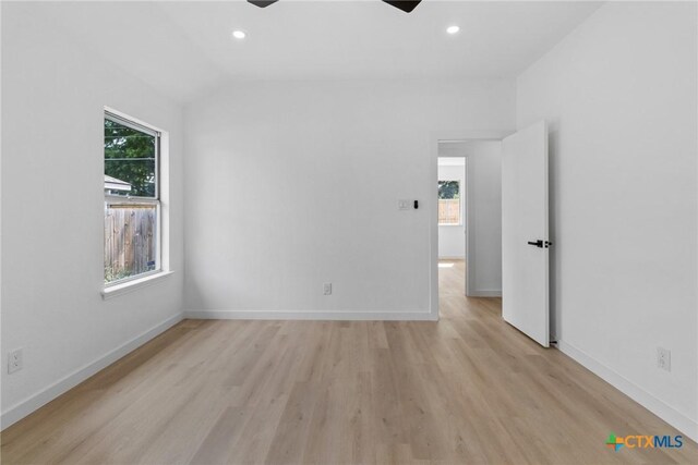 1701 Southwestern Trl, Round Rock, TX 78664 - unfurnished bedroom featuring light wood finished floors, recessed lighting, baseboards, lofted ceiling, and a ceiling fan