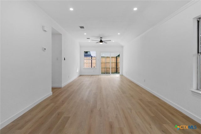 1701 Southwestern Trl, Round Rock, TX 78664 - unfurnished living room featuring light wood-style floors, a ceiling fan, recessed lighting, baseboards, and crown molding