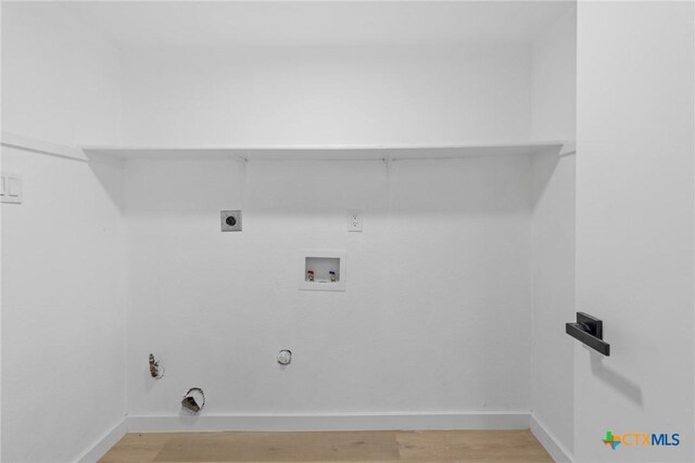 1701 Southwestern Trl, Round Rock, TX 78664 - laundry room featuring gas dryer hookup, hookup for a washing machine, light wood finished floors, and baseboards