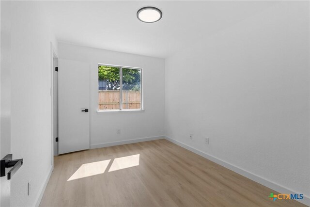 1701 Southwestern Trl, Round Rock, TX 78664 - empty room with wood finished floors and baseboards